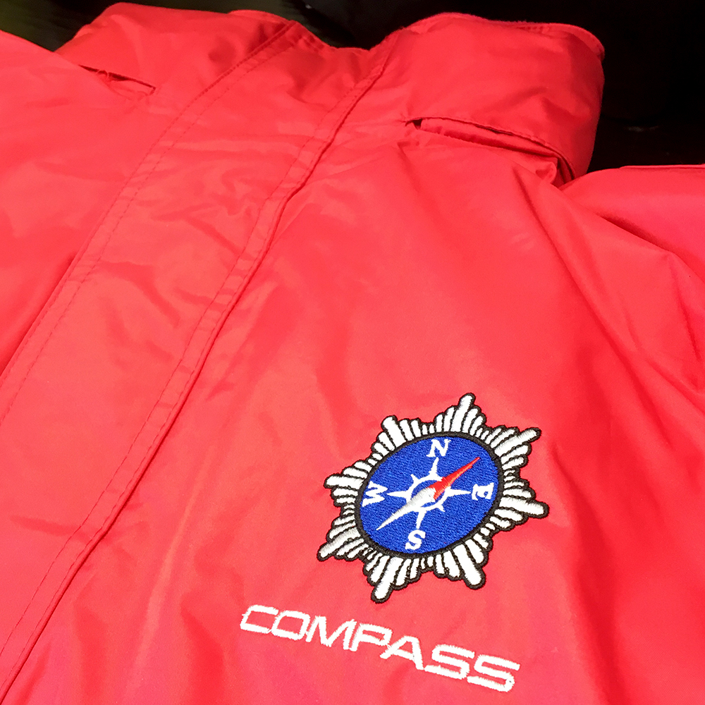 Embroidered logos onto padded jackets and coats.