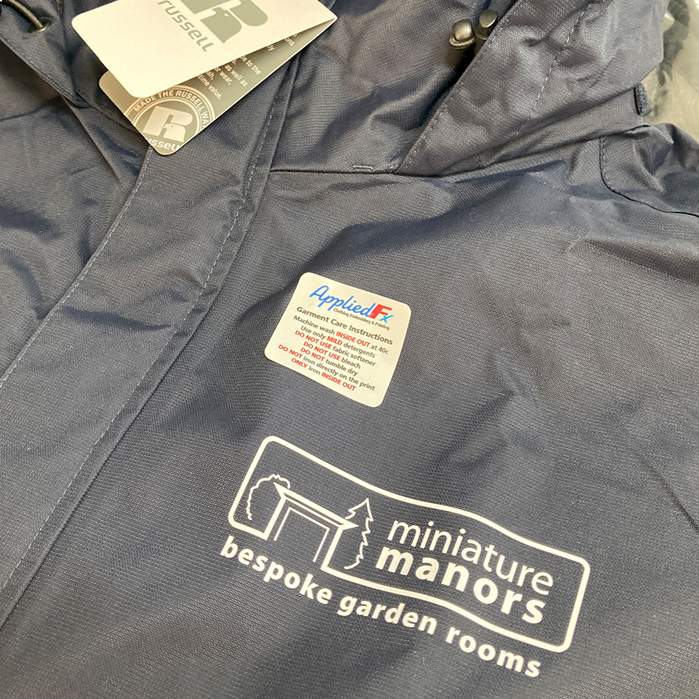 Heat applied Logo onto waterproof jackets for minature manors